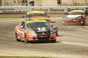 James Vance / Katherine Legge Honda Civic leads a small pack of ST cars.