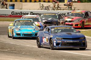 Eric Curran / Lawson Aschenbach Chevy Camaro Z/28.R grabs the lead late in the race.