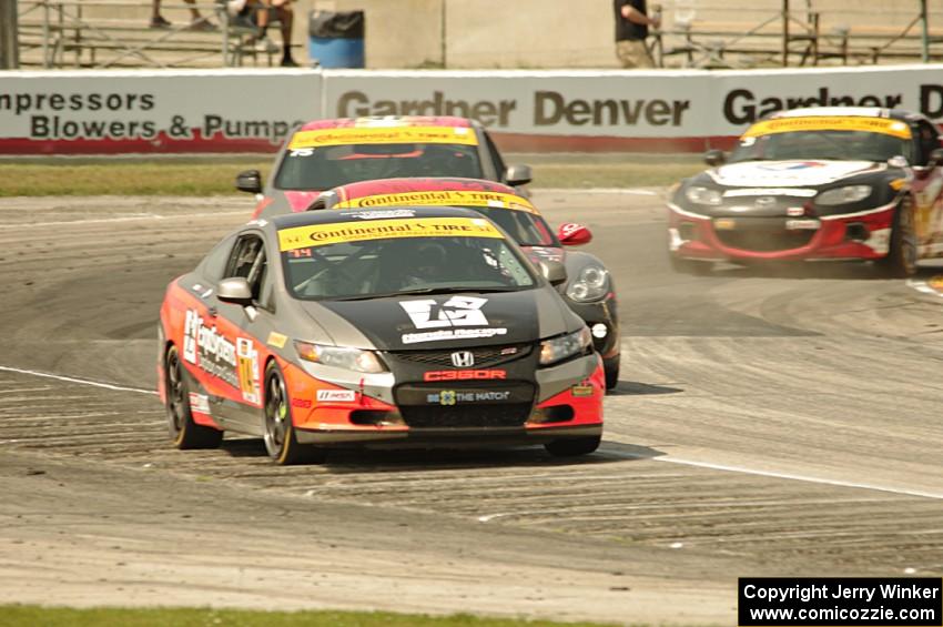 James Vance / Katherine Legge Honda Civic leads a small pack of ST cars.