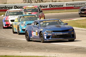 Eric Curran / Lawson Aschenbach Chevy Camaro Z/28.R grabs the lead late in the race.
