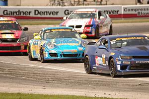 Eric Curran / Lawson Aschenbach Chevy Camaro Z/28.R grabs the lead late in the race.