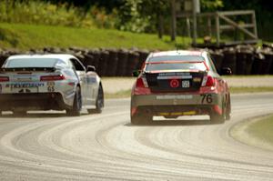 Ray Mason / Pierre Kleinubing Subaru WRX STi passes the Andy Lally / Matt Bell Chevy Camaro Z/28.R