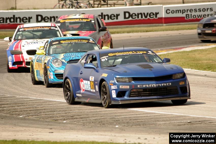 Eric Curran / Lawson Aschenbach Chevy Camaro Z/28.R grabs the lead late in the race.