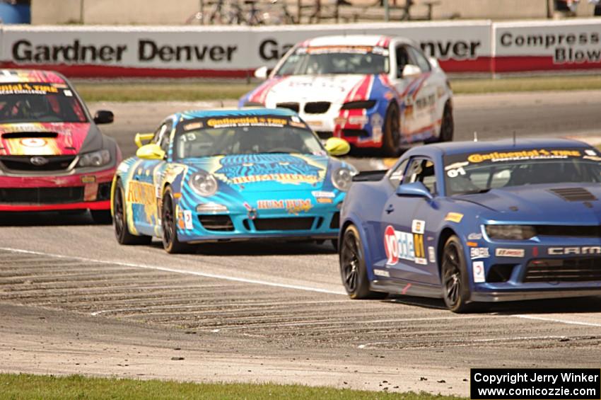 Eric Curran / Lawson Aschenbach Chevy Camaro Z/28.R grabs the lead late in the race.