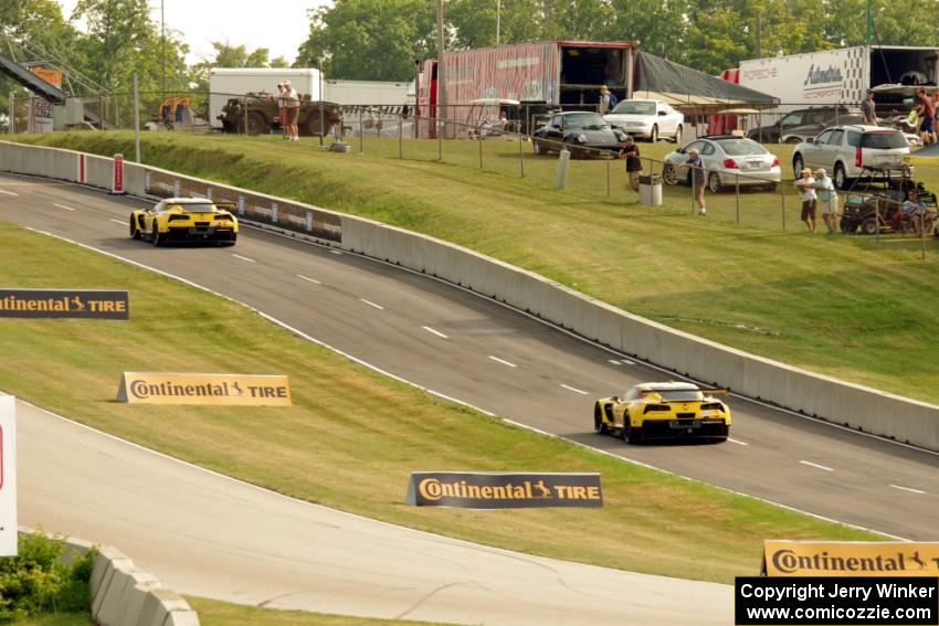 Oliver Gavin / Tommy Milner and Jan Magnussen / Antonio Garcia Chevy Corvette C7.Rs heading into the pits after qualifying
