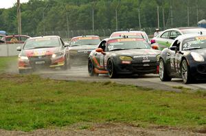 The melee at the start in the first corner.
