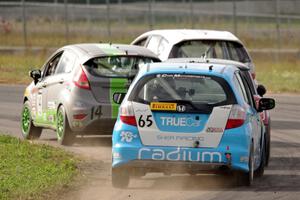 Johan Schwartz's Honda Fit, Nate Stacy's Ford Fiesta, Glenn Nixon's MINI Cooper and Paul Holton's Honda Fit