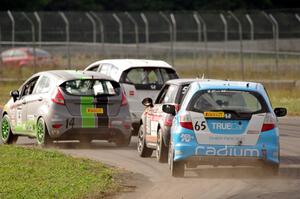 Johan Schwartz's Honda Fit, Nate Stacy's Ford Fiesta, Glenn Nixon's MINI Cooper and Paul Holton's Honda Fit