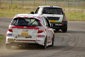 Brian Price's Honda Fit chases Jason Fichter's MINI Cooper