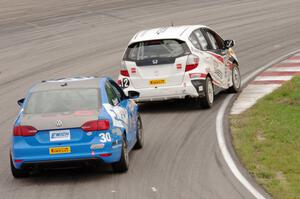 Johan Schwartz's Honda Fit and Fred Emich's VW Jetta GLI