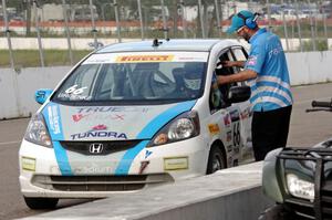 P.J. Groenke's Honda Fit in the pits after Sunday morning practice