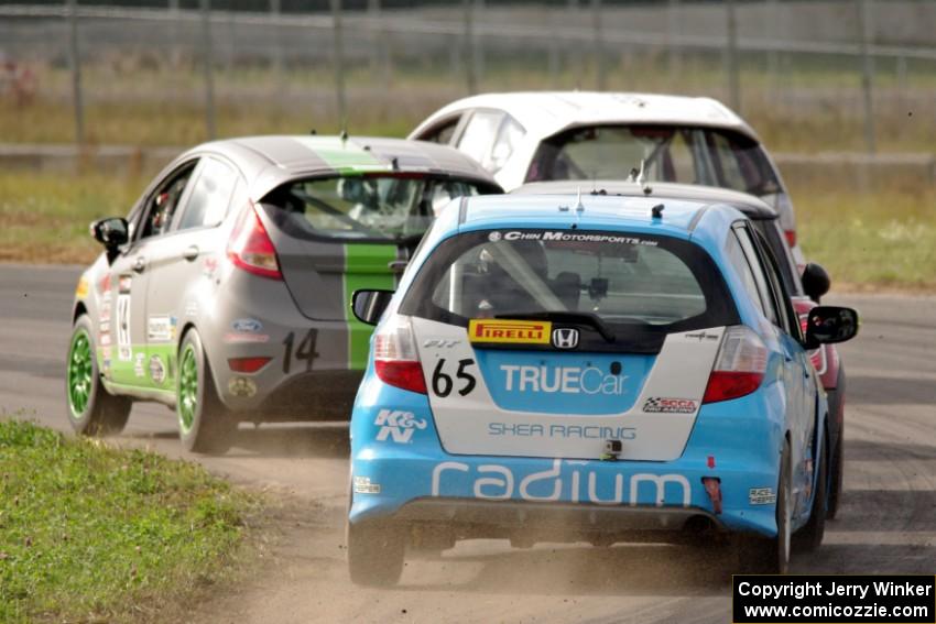 Johan Schwartz's Honda Fit, Nate Stacy's Ford Fiesta, Glenn Nixon's MINI Cooper and Paul Holton's Honda Fit