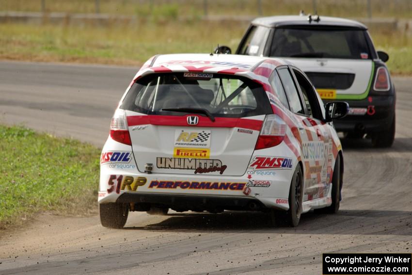 Brian Price's Honda Fit chases Jason Fichter's MINI Cooper