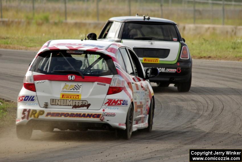 Brian Price's Honda Fit chases Jason Fichter's MINI Cooper