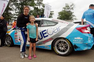 Shea Holbrook and a young fan in front of her Honda Civic Si