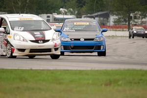 Johan Schwartz's Honda Fit and Fred Emich's VW Jetta GLI