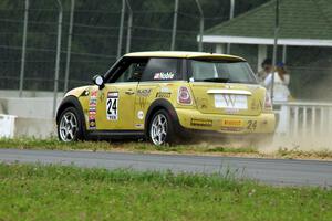 Tom Noble's MINI Cooper goes off the high side of turn 4