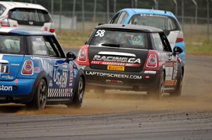 Glenn Nixon's MINI Cooper and Tyler Palmer's MINI Cooper chase the two lead TCB Honda Fits