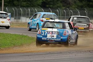 Tyler Palmer's MINI Cooper chases three other cars in the TCB class