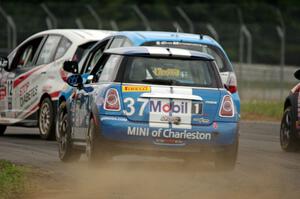 Tyler Palmer's MINI Cooper chases three other cars in the TCB class