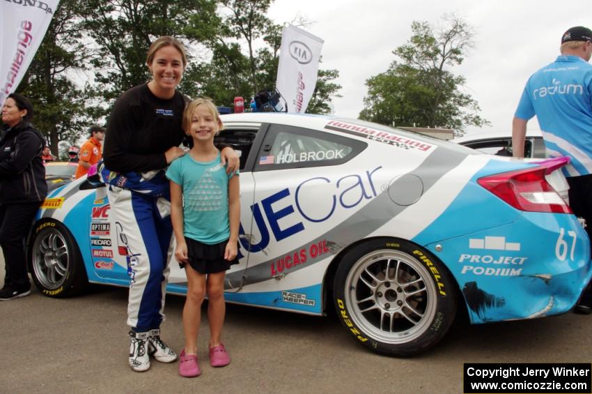 Shea Holbrook and a young fan in front of her Honda Civic Si