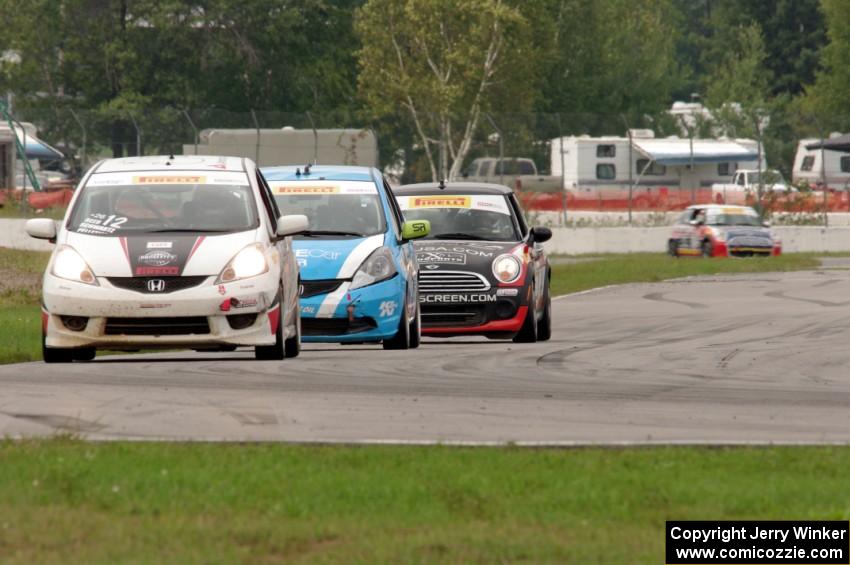 Johan Schwartz's Honda Fit, Paul Holton's Honda Fit and Glenn Nixon's MINI Cooper