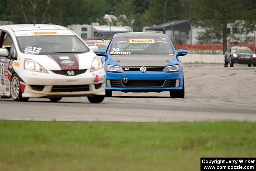 Johan Schwartz's Honda Fit and Fred Emich's VW Jetta GLI