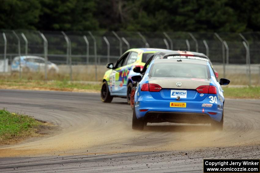 Fred Emich's VW Jetta GLI chases Michael Ashby's and Chris Holter's Mazda 2s