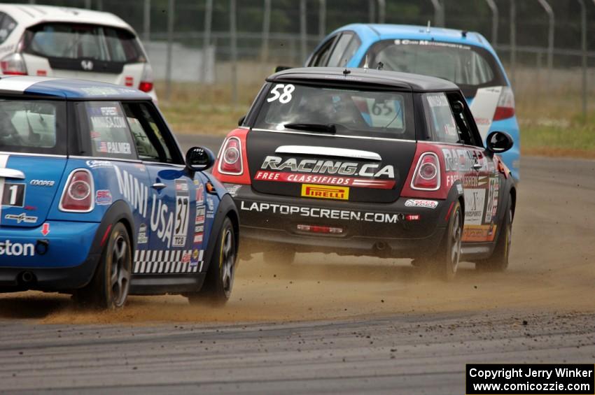 Glenn Nixon's MINI Cooper and Tyler Palmer's MINI Cooper chase the two lead TCB Honda Fits