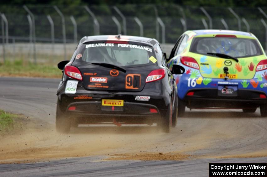 Chris Holter's Mazda 2 chases Michael Ashby's Mazda 2