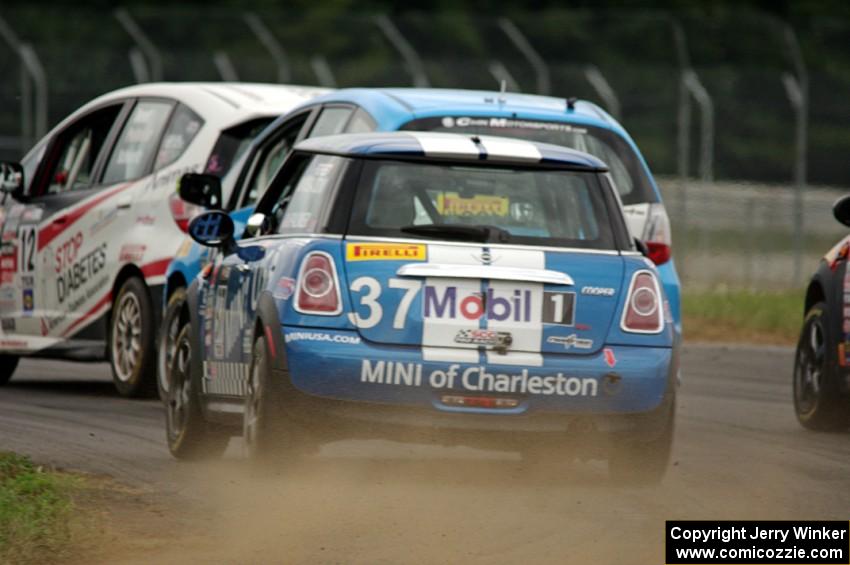 Tyler Palmer's MINI Cooper chases three other cars in the TCB class