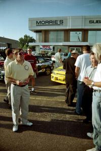 Paul Eklund speaks to rally fans at Morrie's Subaru.