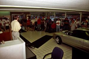 Paul Eklund speaks to rally fans at Morrie's Subaru.