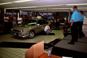 Henry and Cindy Krolikowski speak to rally fans at Morrie's Subaru.