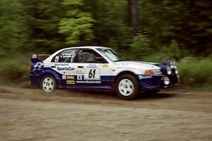 Karl Scheible / Russ Hughes Mitsubishi Lancer Evo V at speed on SS1, Waptus.