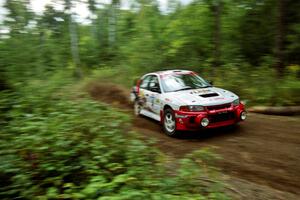 Garen Shrader / Michael Fennell Mitsubishi Lancer Evo IV at speed on SS1, Waptus.