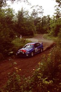 Peter Cunningham / Jim Gill Mitsubishi Lancer Evo VI at speed on SS1, Waptus.