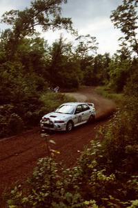 Seamus Burke / Frank Cunningham Mitsubishi Lancer Evo IV at speed on SS1, Waptus.