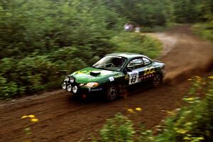 Tad Ohtake / Bob Martin Ford Escort ZX2 at speed on SS1, Waptus.