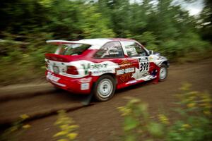 Kurosh Jahromi / Tony Lumino Ford Escort Cosworth RS at speed on SS1, Waptus.