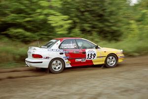 Janusz Jastrzebski / Tomasz Zaremba Subaru Impreza at speed on SS1, Waptus.