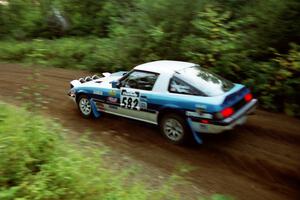 Doug Dill / Tyler Dill Mazda RX-7 at speed on SS1, Waptus.