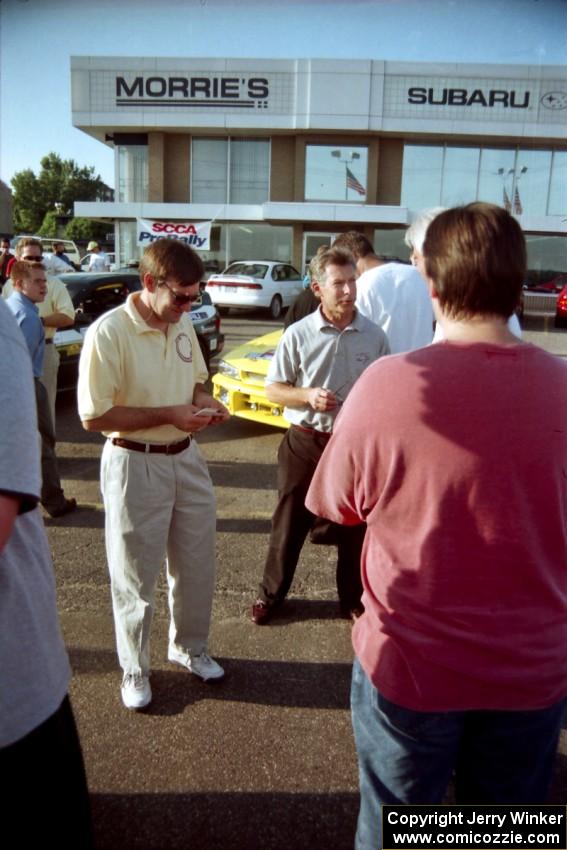 Paul Eklund speaks to rally fans at Morrie's Subaru.