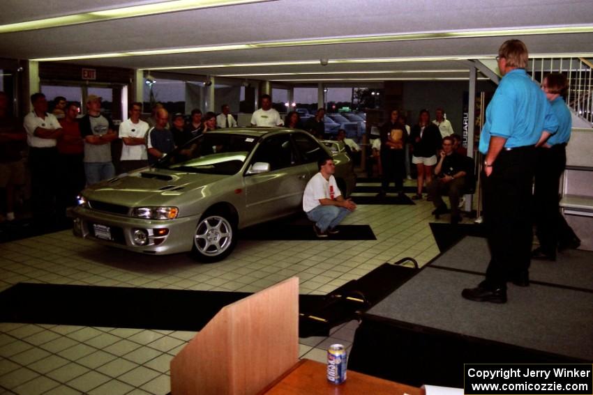 Henry and Cindy Krolikowski speak to rally fans at Morrie's Subaru.