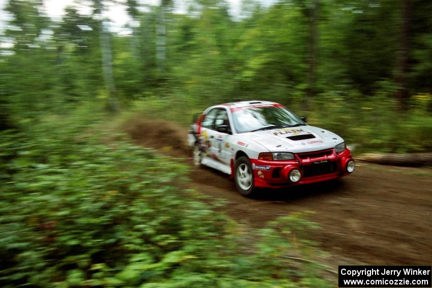 Garen Shrader / Michael Fennell Mitsubishi Lancer Evo IV at speed on SS1, Waptus.