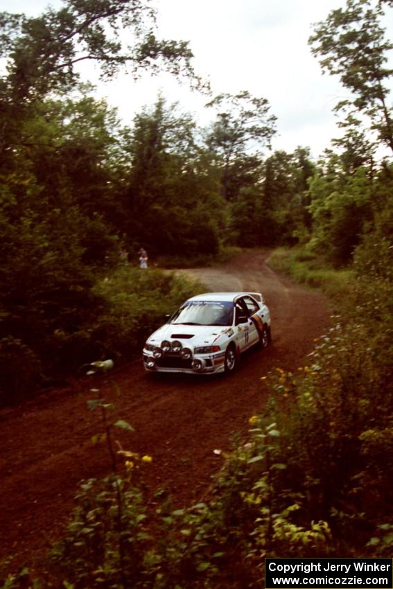 Pete Lahm / Matt Chester Mitsubishi Lancer Evo IV at speed on SS1, Waptus.