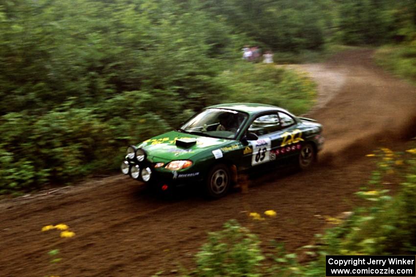 Tad Ohtake / Bob Martin Ford Escort ZX2 at speed on SS1, Waptus.