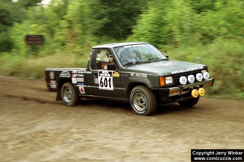 Mike Halley / Emily Burton-Weinman Mitsubishi Mighty Max at speed on SS1, Waptus.