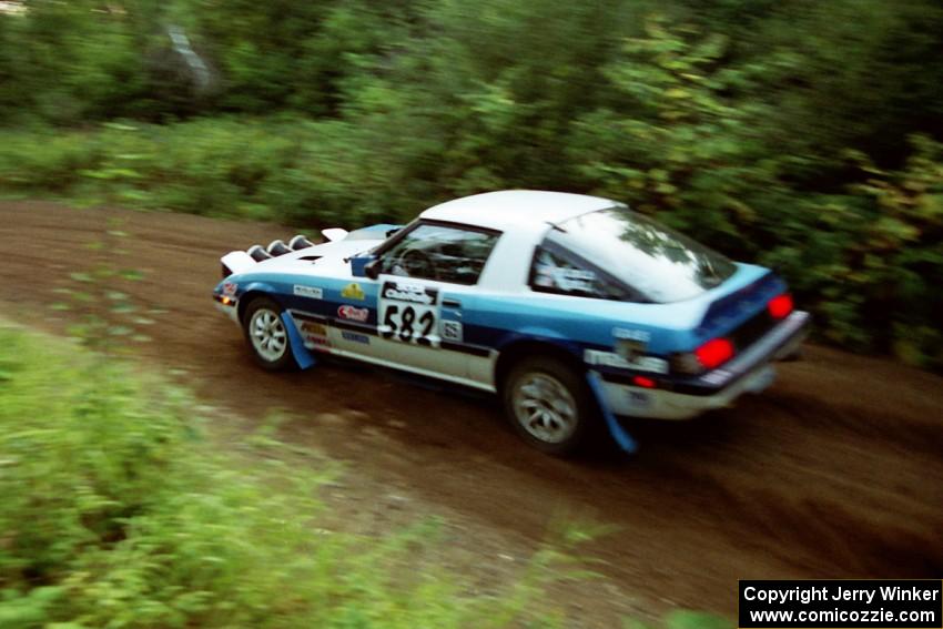 Doug Dill / Tyler Dill Mazda RX-7 at speed on SS1, Waptus.