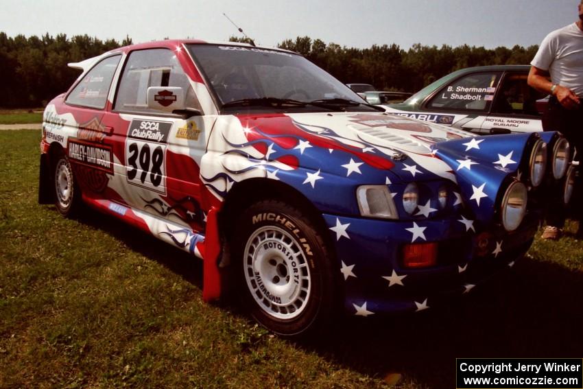 Kurosh Jahromi / Tony Lumino Ford Escort Cosworth RS at parc expose prior to SS8, Speedway Shennanigans.